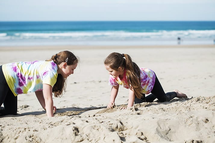 Children play in the sand